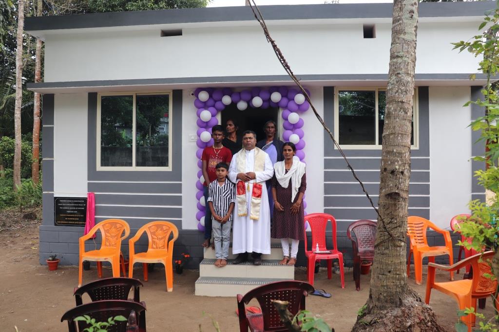 Rev. Fr. Alex Prashanth Sequeira- Director, ODP with the beneficiary at Karadigodu- Siddapura