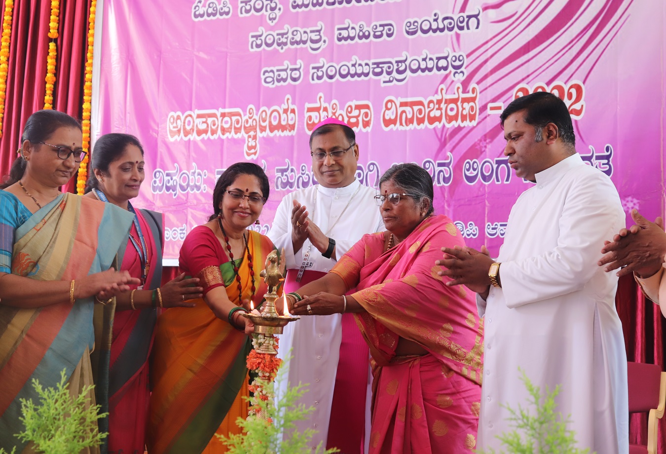Dignitaries inaugurating The Women's Day Program by igniting the lamp